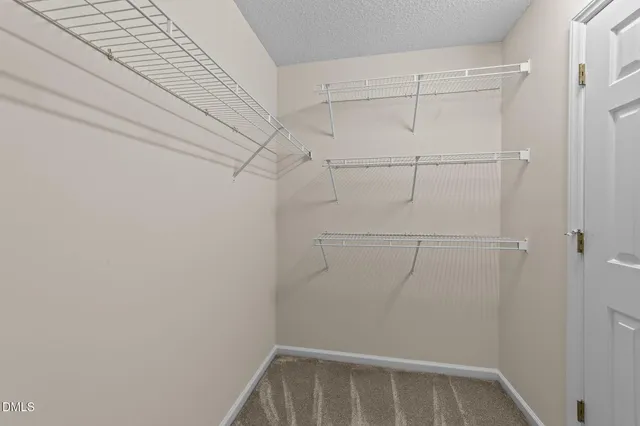 a view of a room with racks on the wall