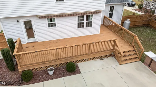 a view of a house with wooden fence