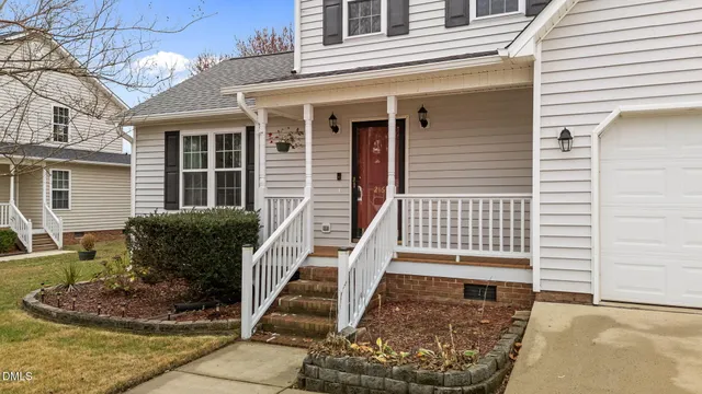 a front view of a house with stairs