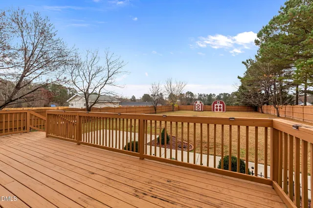 a view of deck with wooden floor and fence