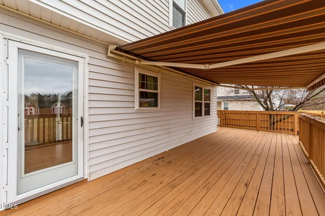 a view of outdoor space with wooden floor
