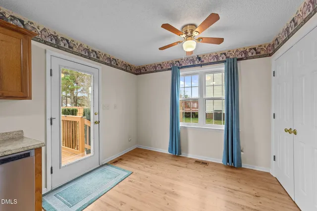 a view of an empty room with a window