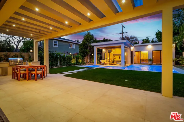 a view of a floor to ceiling window and potted plant
