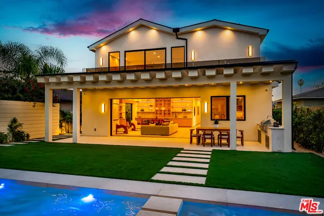 a bedroom with a bed and a chair