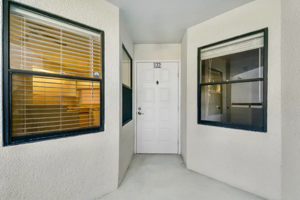 a view of swimming pool with outdoor seating and lake