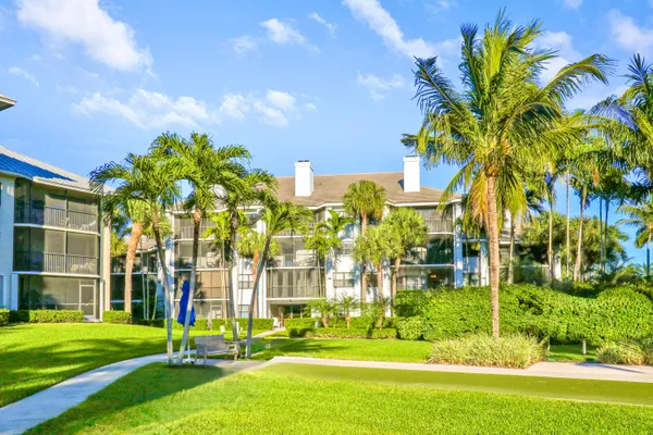 a swimming pool with outdoor seating and city view