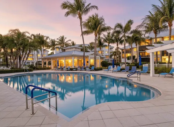 a view of a patio with couches chairs and a fire pit