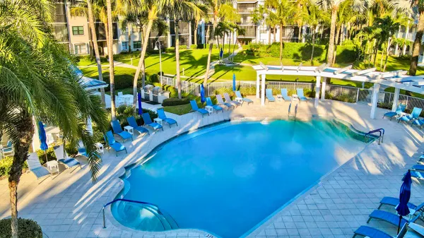 a view of a chairs and table in a patio