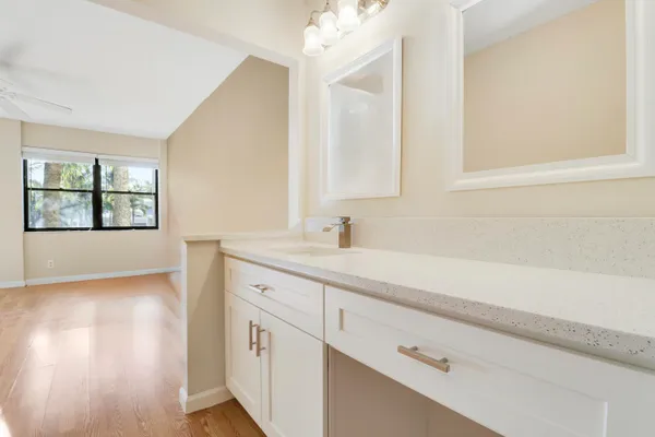 an empty room with windows and closet