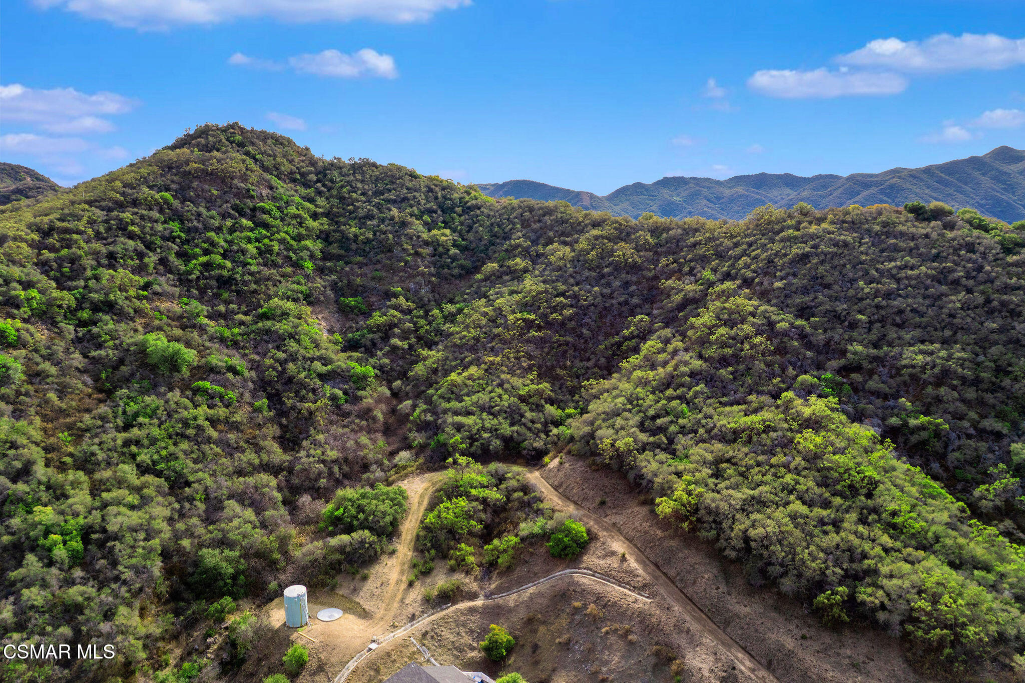 East Carlisle Road Thousand Oaks, CA 91361 - Photo 2 of 13 a view of a houses with a lush green hillside
