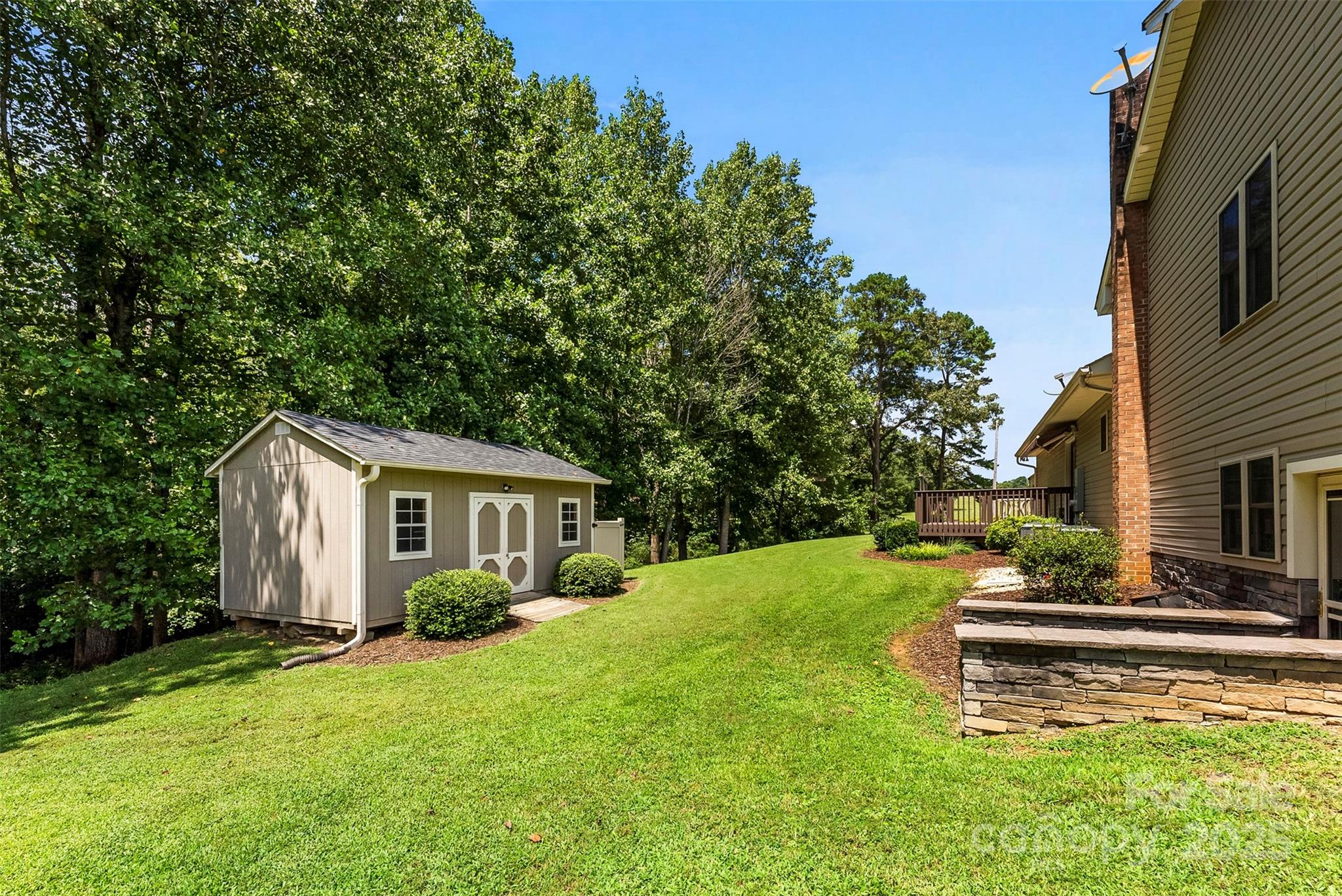 213 Press Sweezy Road Kings Mountain, NC 28086 - Photo 36 of 43 a white house that has a tree in front of a house