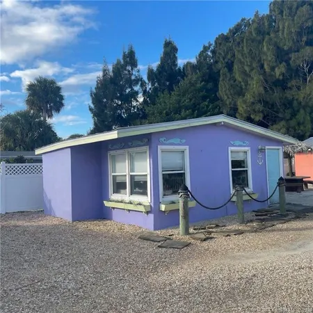 a view of a house with a yard and garage