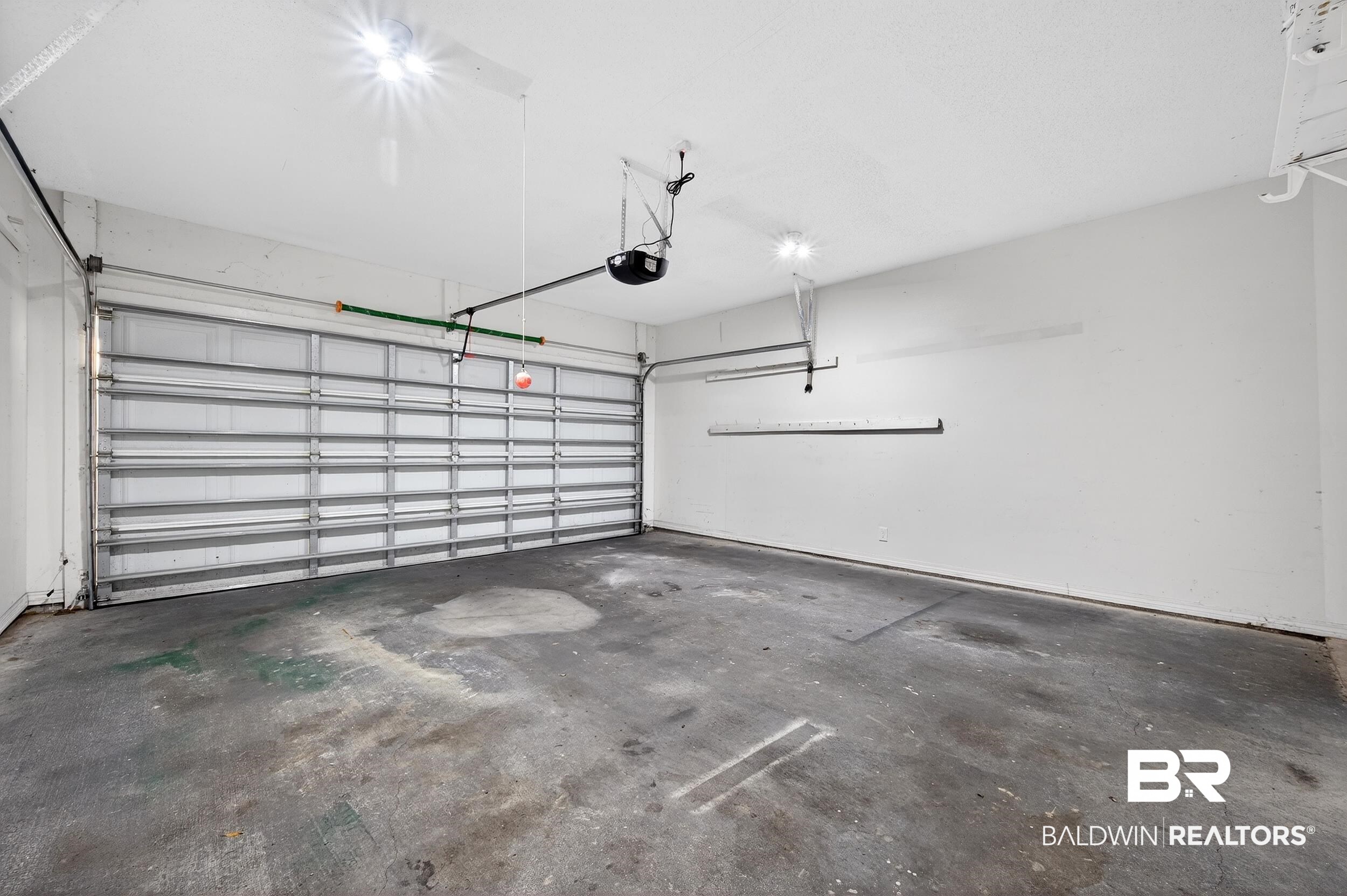 7050 Highpointe Place West Daphne, AL 36527 - Photo 59 of 66 Garage featuring a garage door opener