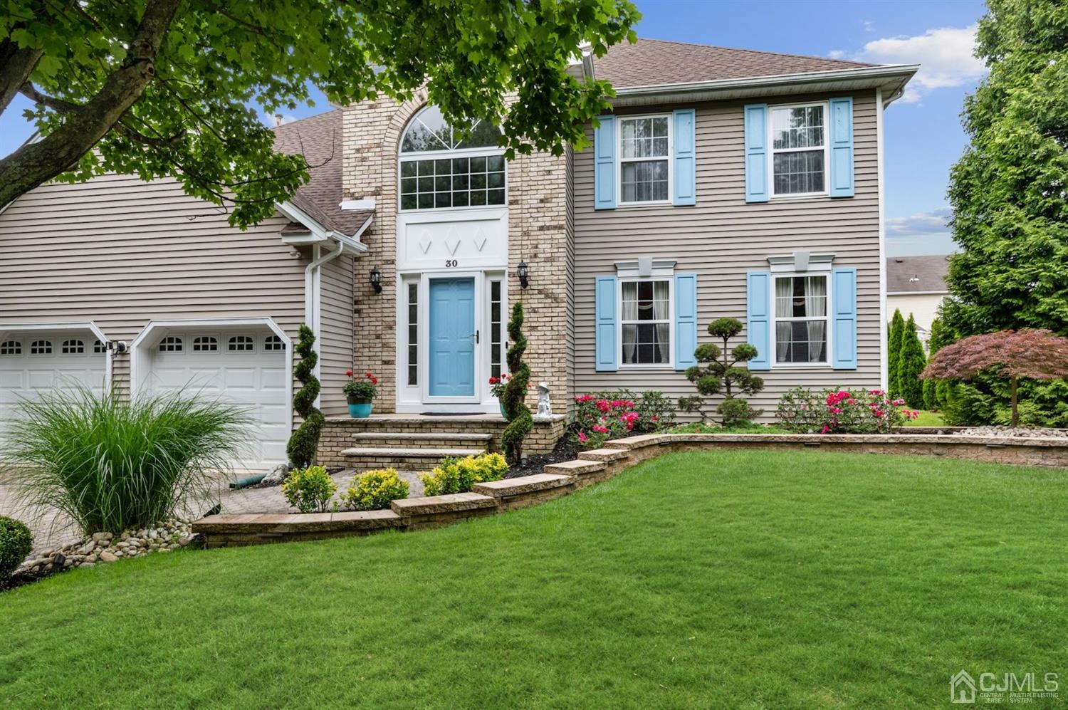 a front view of house with yard and outdoor seating