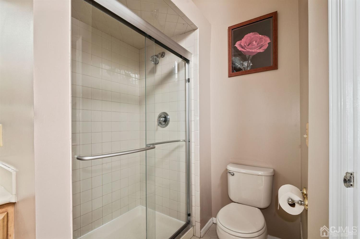 30 Brandywine Drive Old Bridge, NJ 07747 - Photo 14 of 39 a white toilet sitting next to a bathroom sink