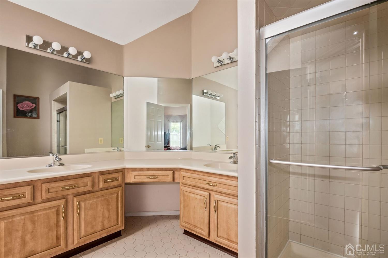 30 Brandywine Drive Old Bridge, NJ 07747 - Photo 15 of 39 a spacious bathroom with a double vanity sink a large mirror and a shower