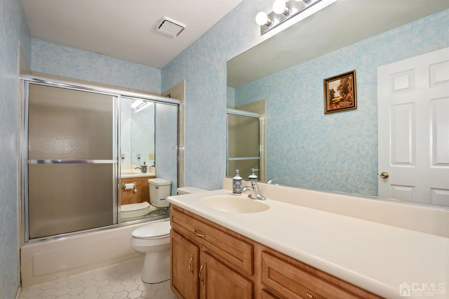 30 Brandywine Drive Old Bridge, NJ 07747 - Photo 20 of 39 a bathroom with a sink a toilet and shower