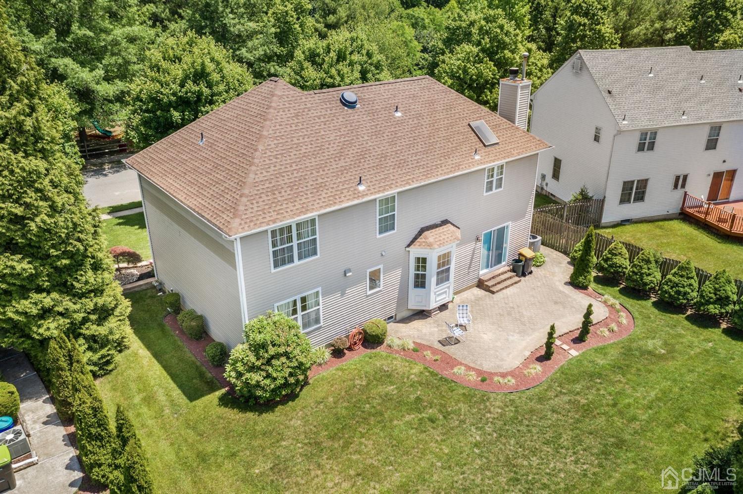 30 Brandywine Drive Old Bridge, NJ 07747 - Photo 29 of 39 a aerial view of a house with table and chairs in a yard