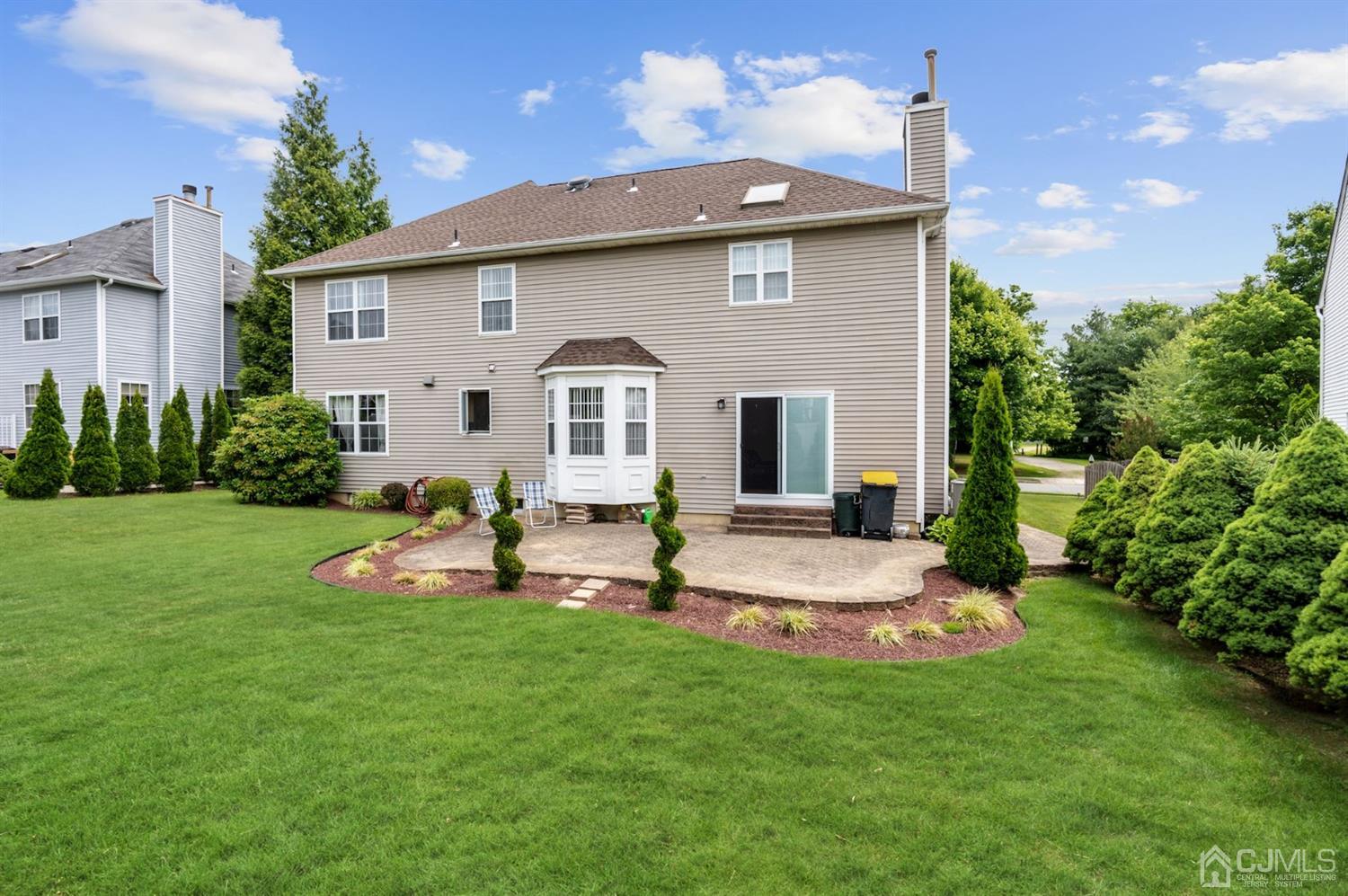 30 Brandywine Drive Old Bridge, NJ 07747 - Photo 36 of 39 a view of a house with backyard sitting area and garden