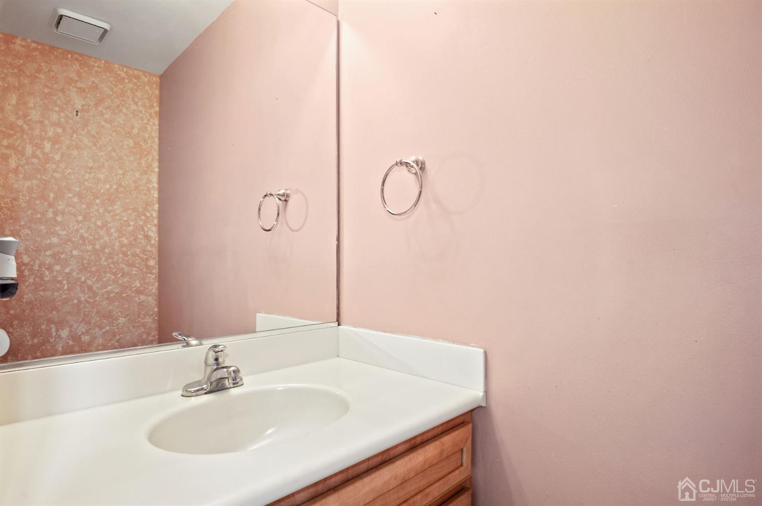 30 Brandywine Drive Old Bridge, NJ 07747 - Photo 10 of 39 a bathroom with a sink and a mirror
