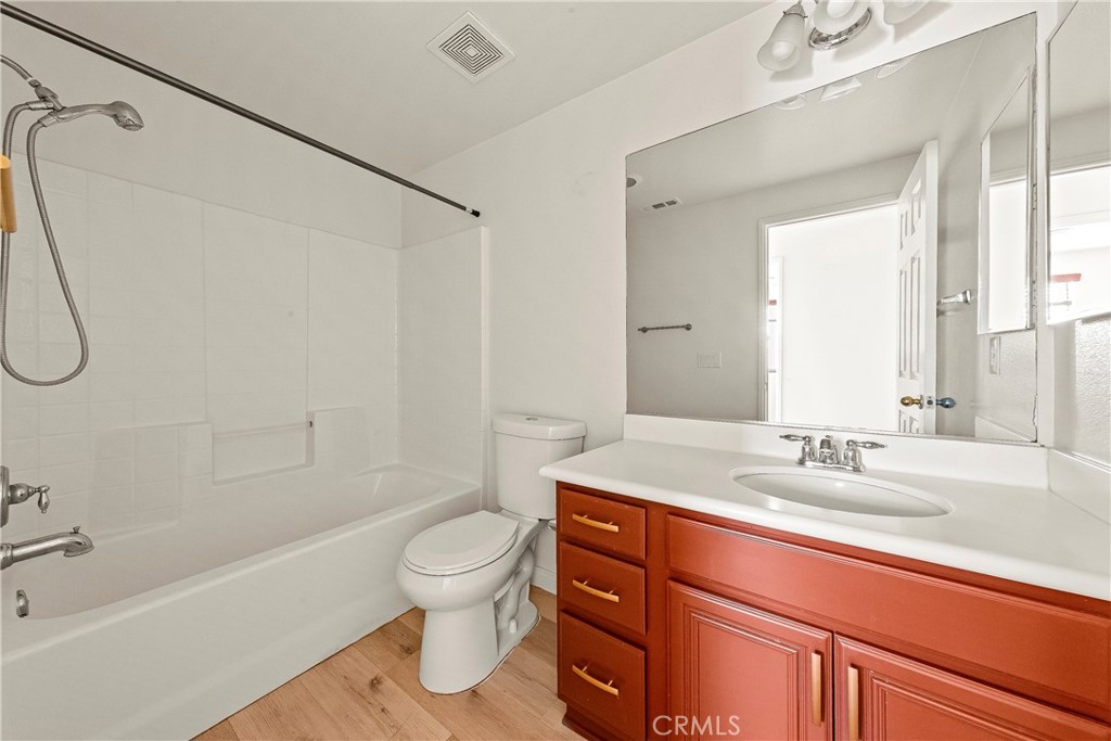 4660 Spice Street Lancaster, CA 93536 - Photo 25 of 42 a bathroom with a sink a toilet and a bathtub
