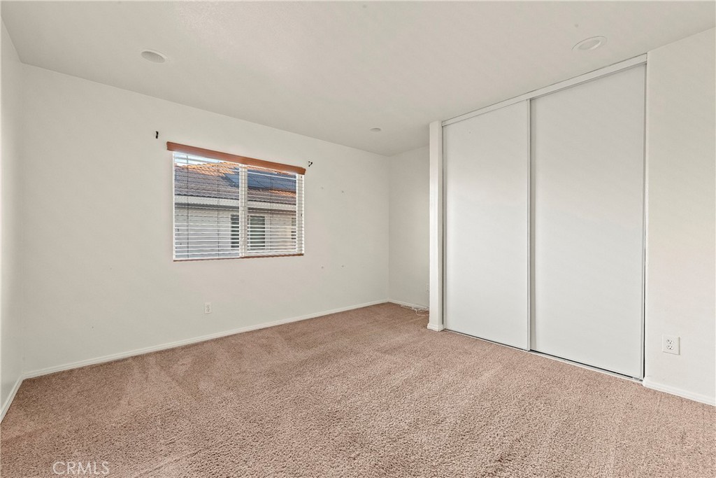 4660 Spice Street Lancaster, CA 93536 - Photo 28 of 42 a view of an empty room with a window