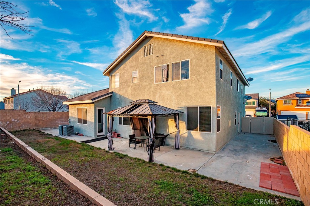 4660 Spice Street Lancaster, CA 93536 - Photo 35 of 42 a front view of a house with a yard
