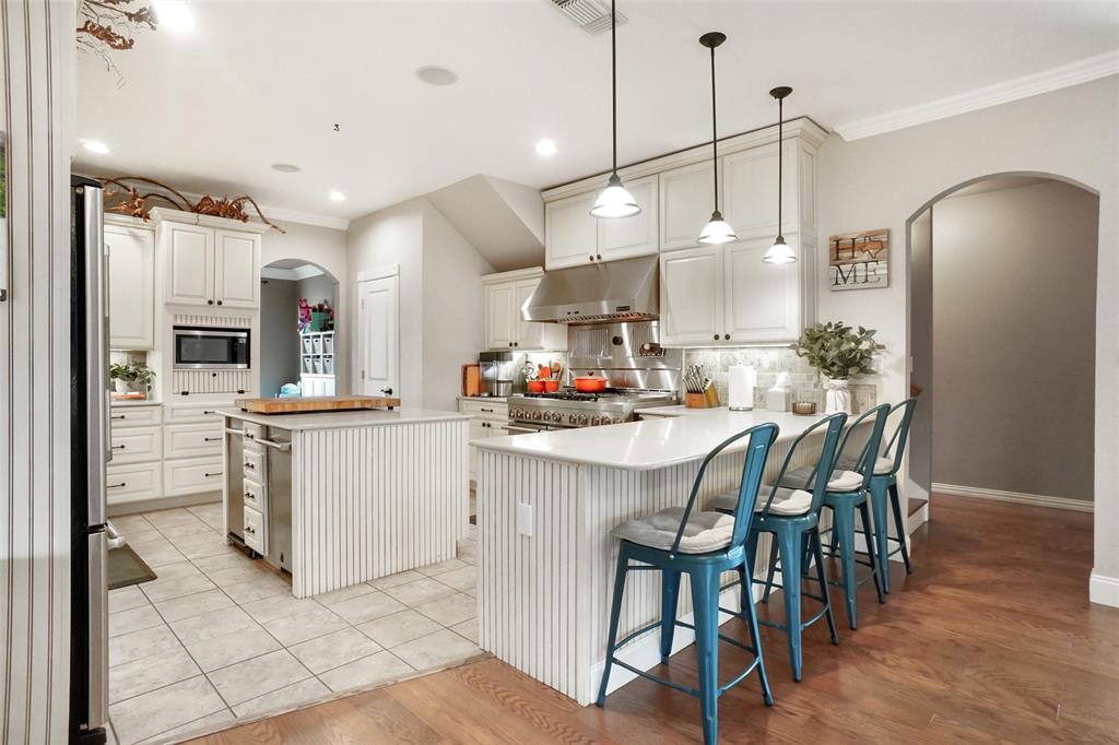 13340 John Day Road Haslet, TX 76052 - Photo 6 of 30 a kitchen with white cabinets and refrigerator