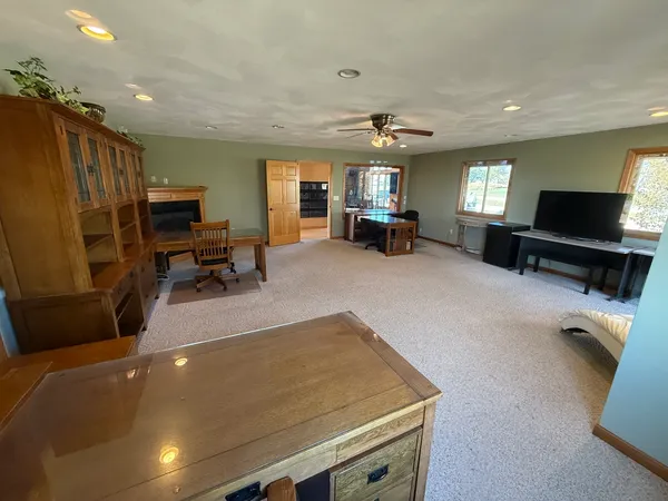 a view of a room with wooden floor and sink