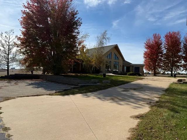 a view of a swimming pool and a yard