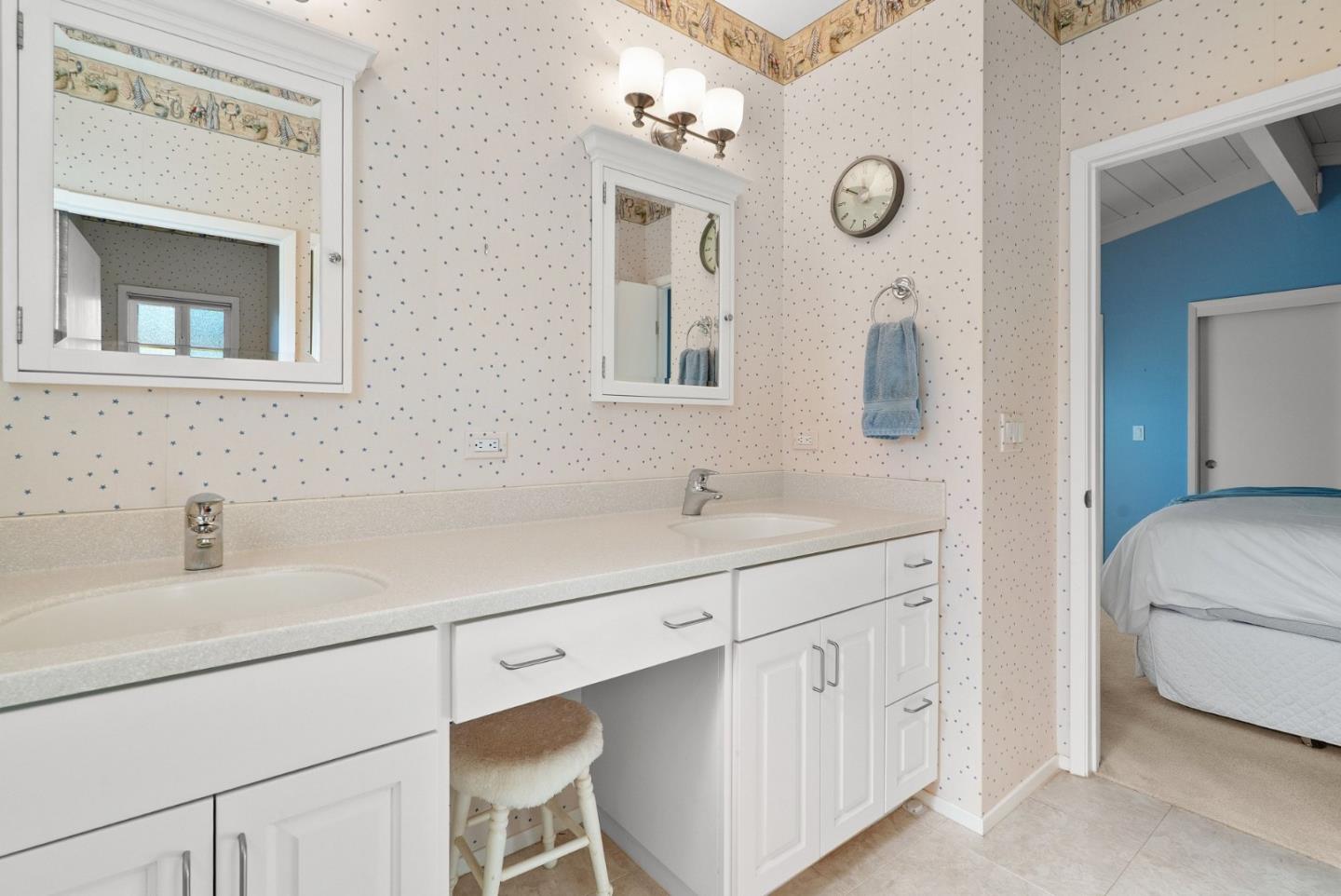 522 Spruce Street Aptos, CA 95003 - Photo 21 of 47 a en suite bathroom with a double vanity sink a mirror and a