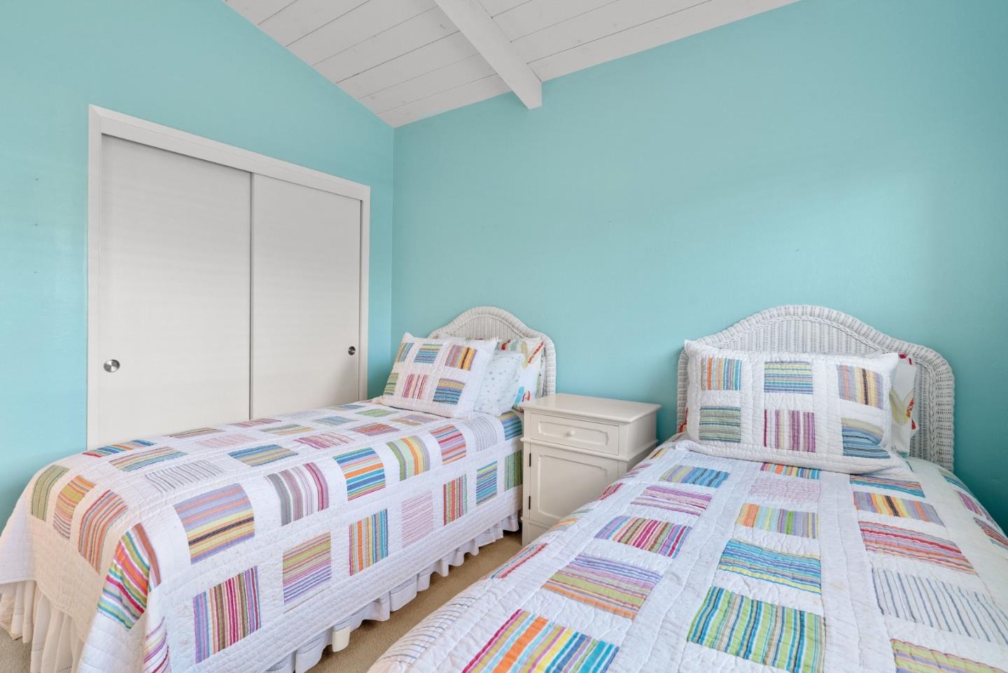 522 Spruce Street Aptos, CA 95003 - Photo 23 of 47 a bedroom with two beds and a baby crib