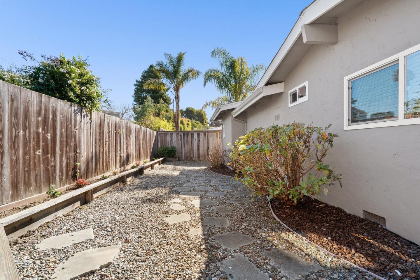 522 Spruce Street Aptos, CA 95003 - Photo 32 of 47 a view of a backyard with wooden fence