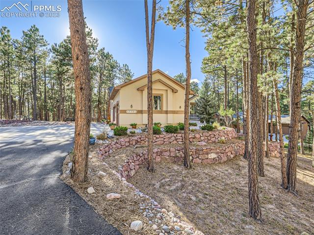 17794 Sawmill Road Colorado Springs, CO 80908 - Photo 3 of 29 Front of the Home from the Drive Way