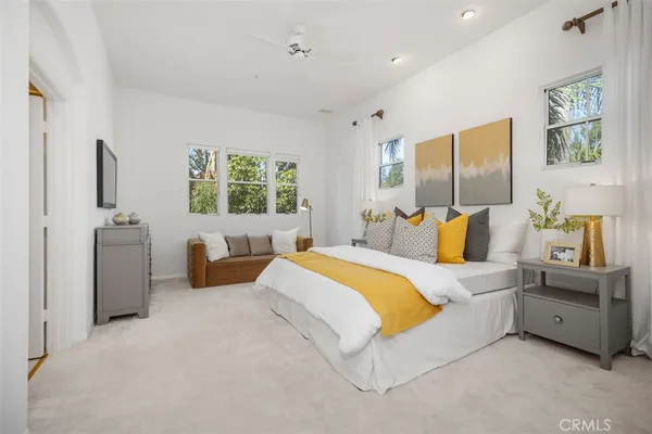 a bedroom with bed and window