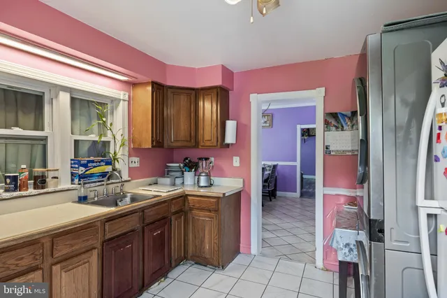 a spacious bathroom with a sink a vanity and a mirror