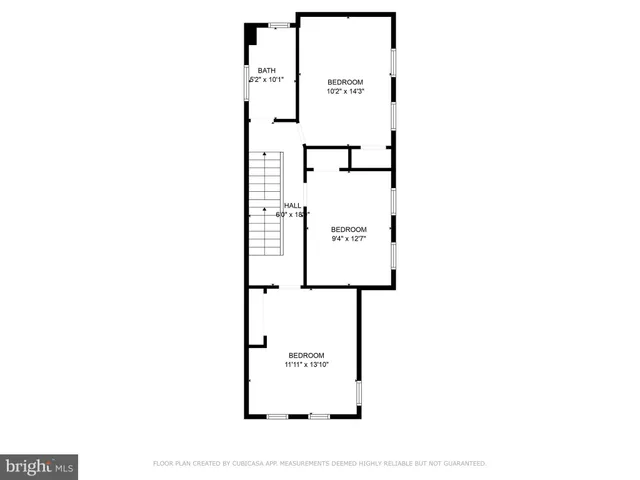 a picture of a bench in front of a wall