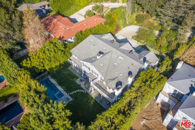 an aerial view of a house with a garden