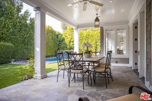 a view of a backyard with sitting area