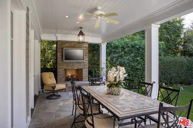 a swimming pool with outdoor seating and yard