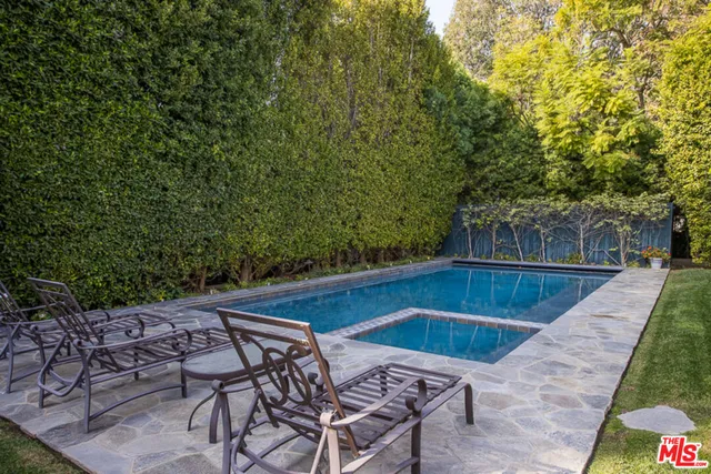 a flower garden is sitting in front of a building