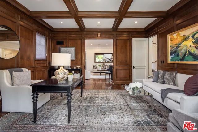 a view of living room with furniture and a potted plant