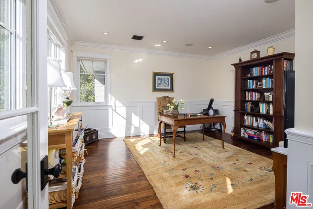 a spacious bathroom with a double vanity sink a mirror a and a shower