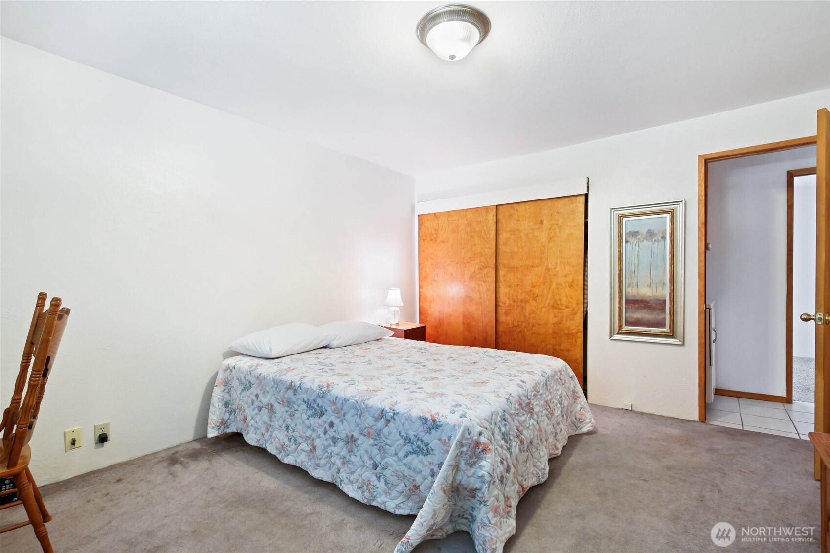 2670 Southeast Bielmeier Road Port Orchard, WA 98367 - Photo 15 of 39 a bedroom with a bed and a window