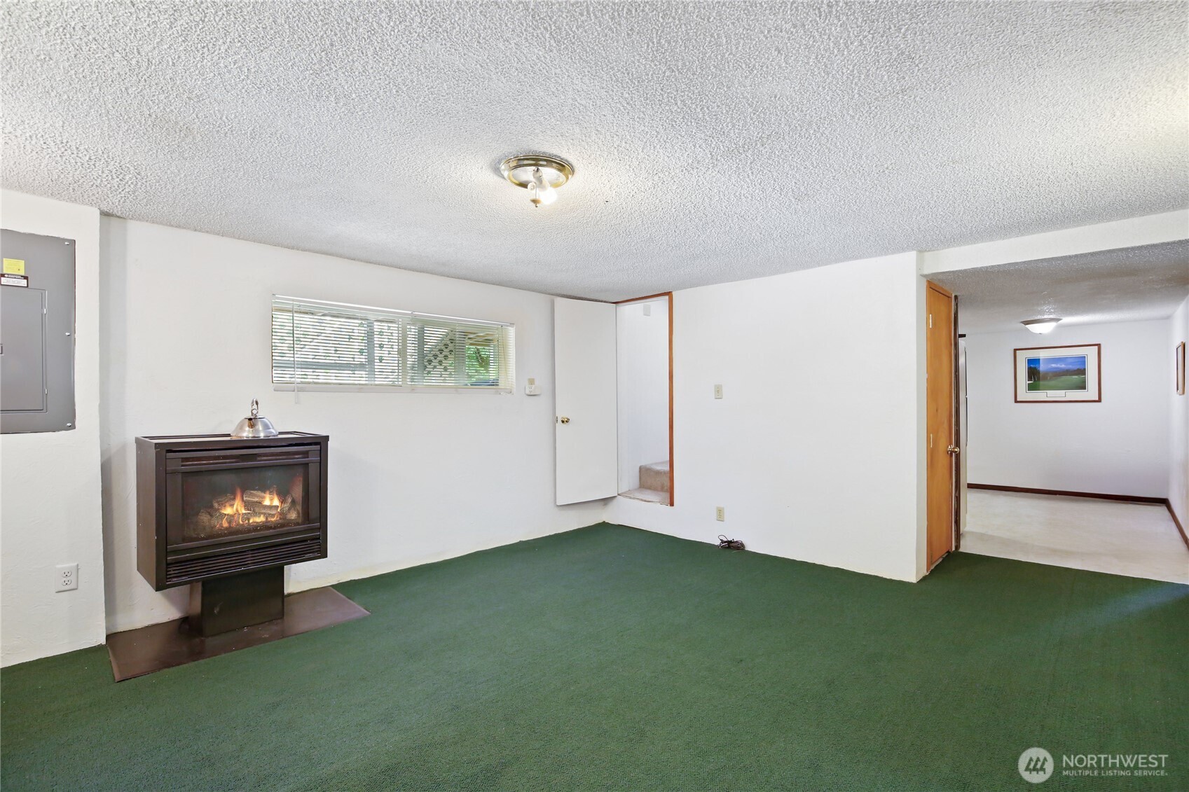 2670 Southeast Bielmeier Road Port Orchard, WA 98367 - Photo 17 of 39 a view of empty room with window and fireplace