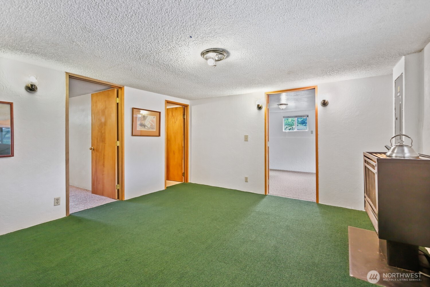 2670 Southeast Bielmeier Road Port Orchard, WA 98367 - Photo 18 of 39 a view of livingroom with hardwood floor and a flat screen tv