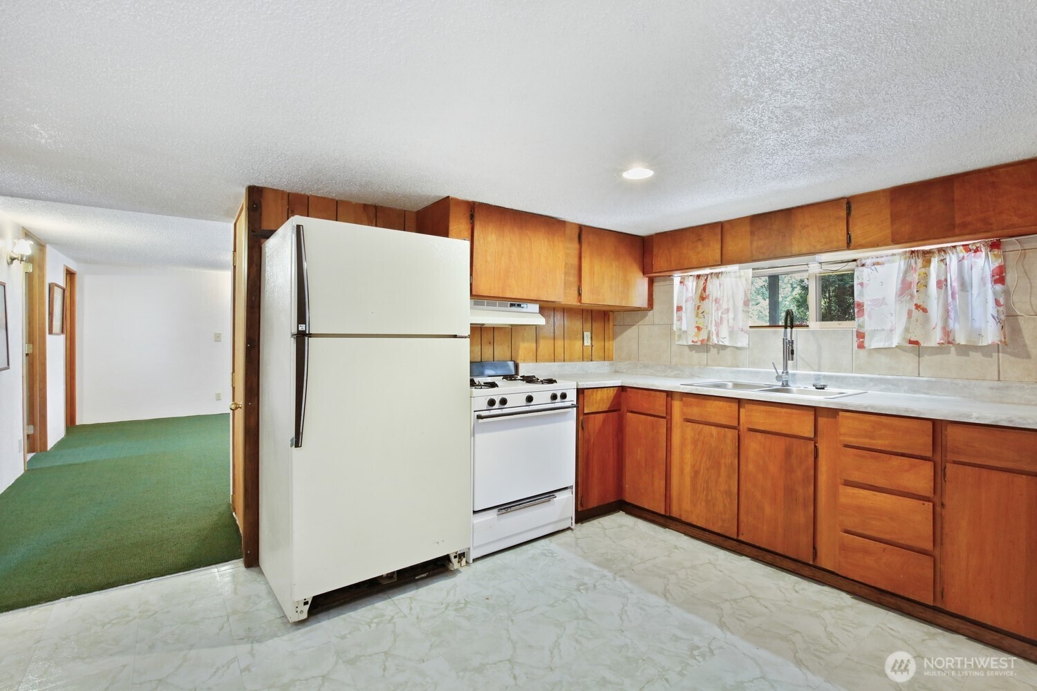 2670 Southeast Bielmeier Road Port Orchard, WA 98367 - Photo 19 of 39 a kitchen with stainless steel appliances granite countertop a refrigerator a sink and a stove