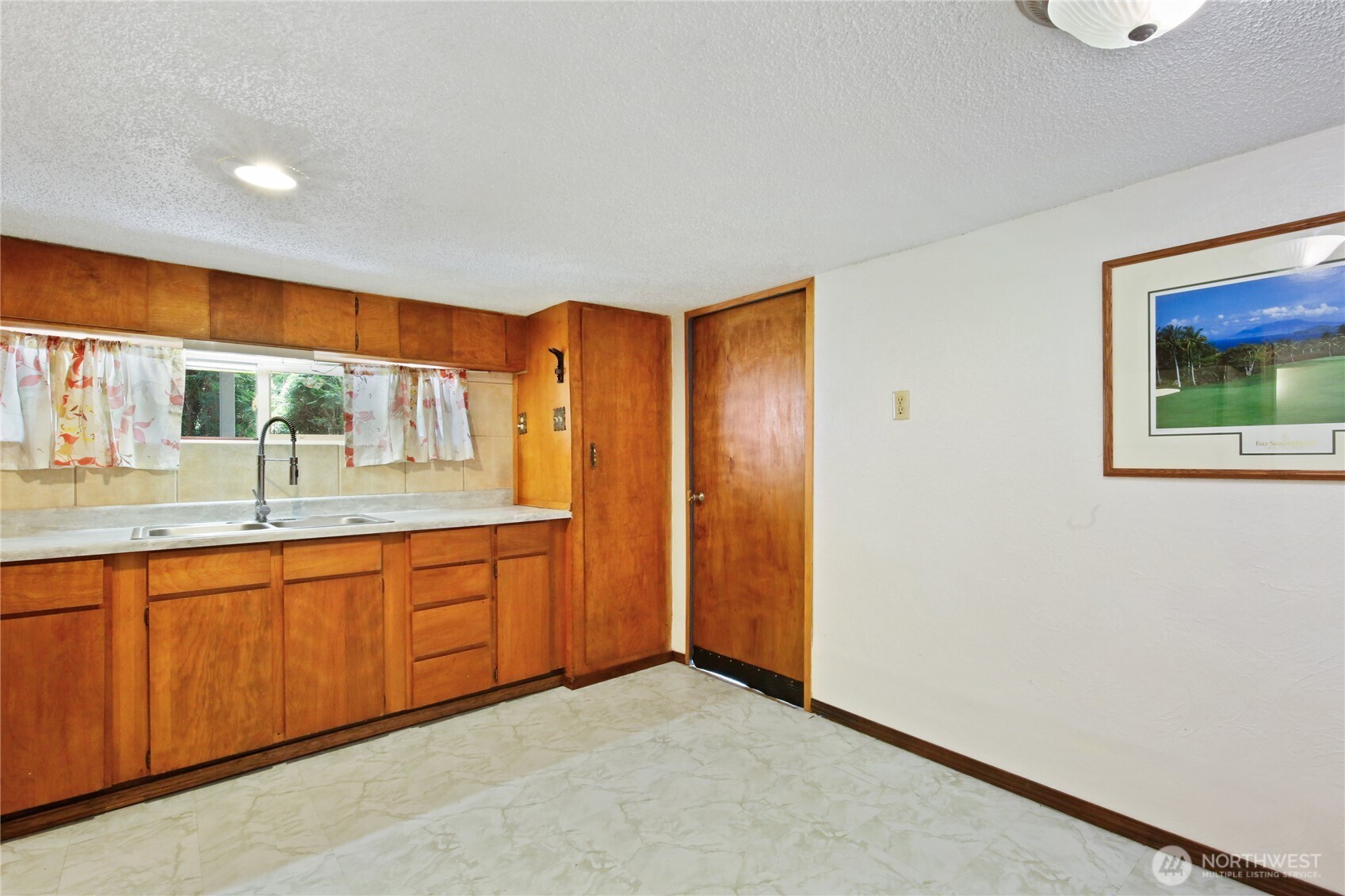 2670 Southeast Bielmeier Road Port Orchard, WA 98367 - Photo 21 of 39 a spacious bathroom with a granite countertop sink and a mirror