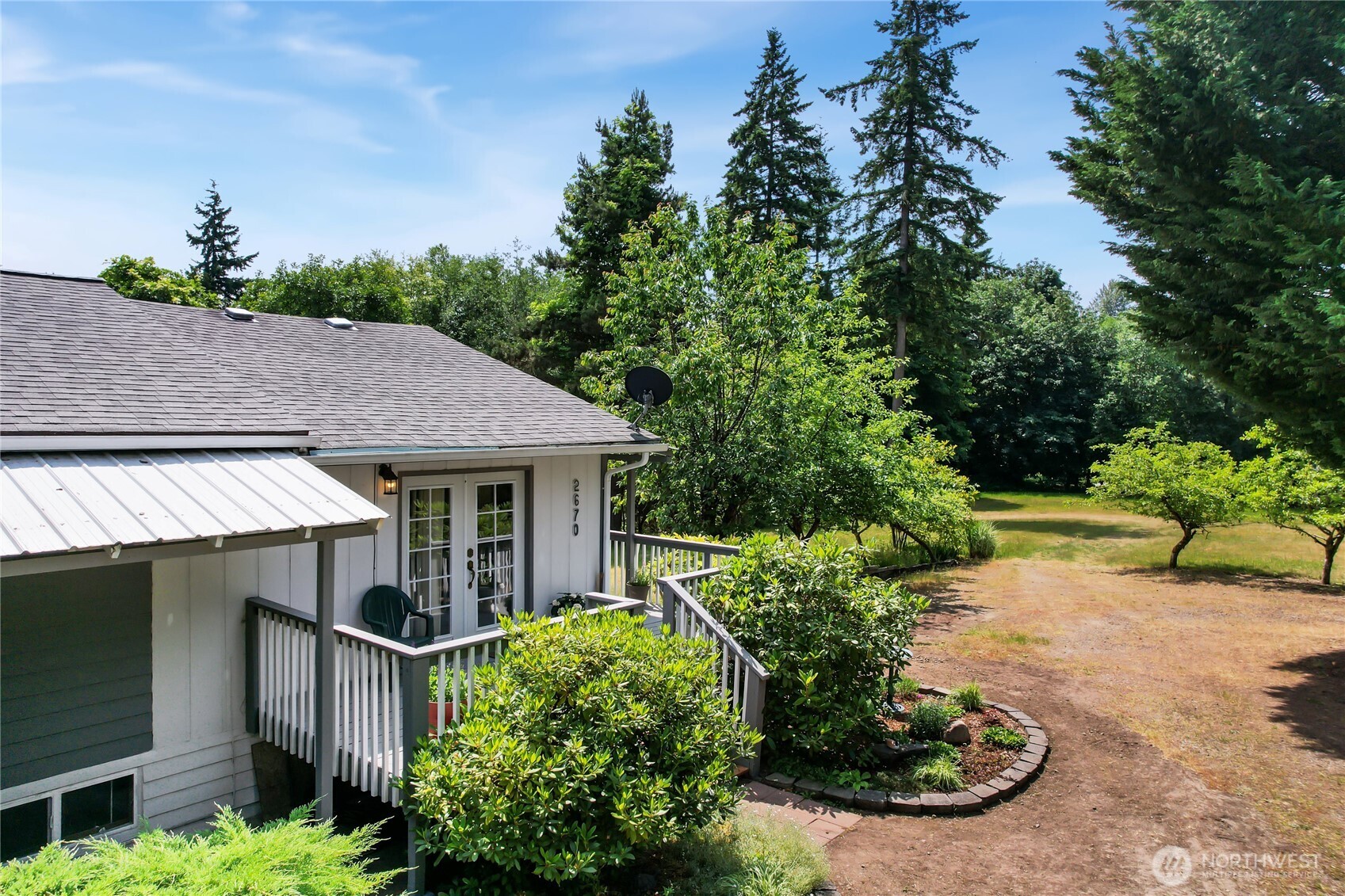 2670 Southeast Bielmeier Road Port Orchard, WA 98367 - Photo 38 of 39 a view of a house with potted plants and large trees