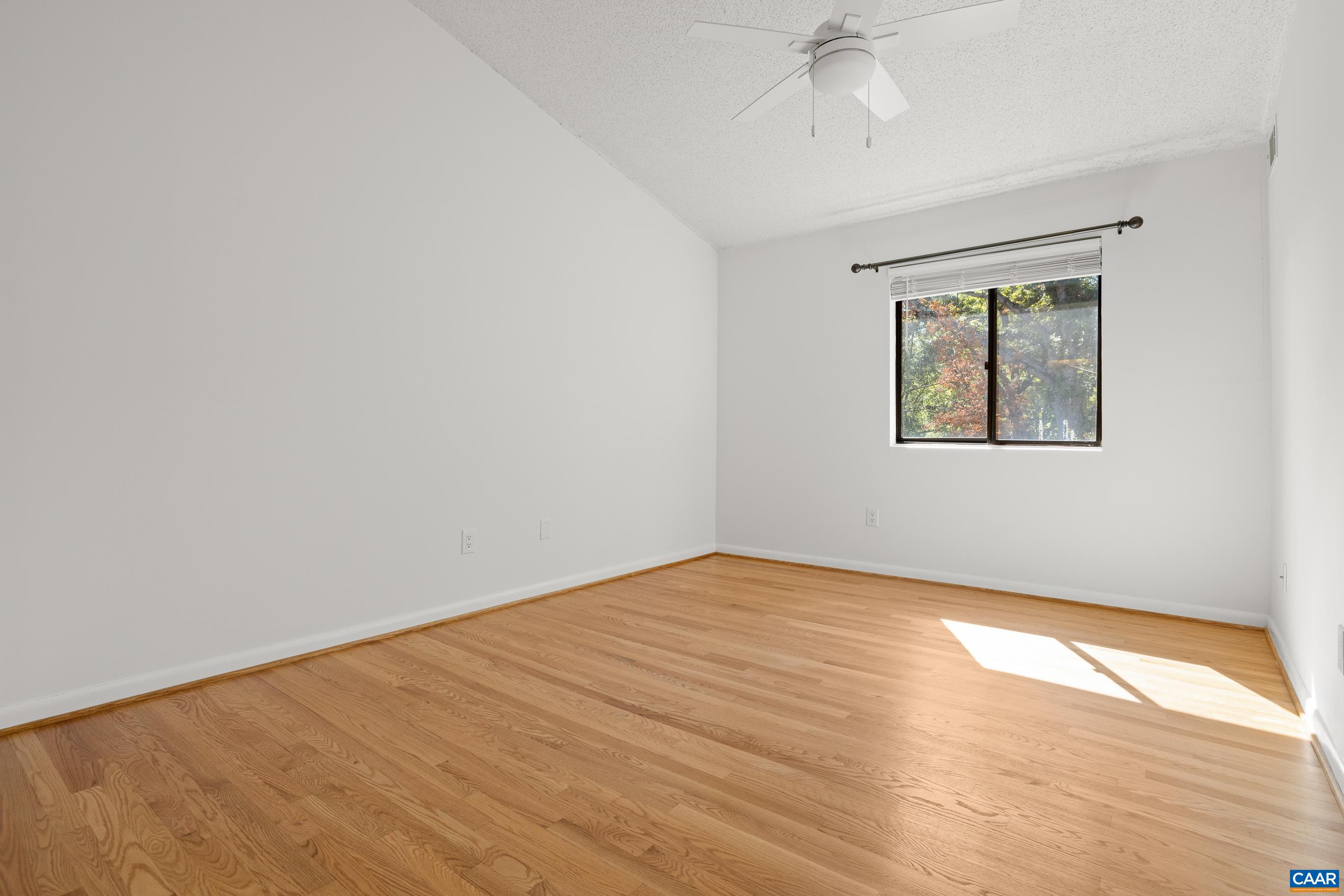127 Turtle Creek Road, Unit 12 Charlottesville, VA 22901 - Photo 13 of 33 wooden floor in an empty room with a window